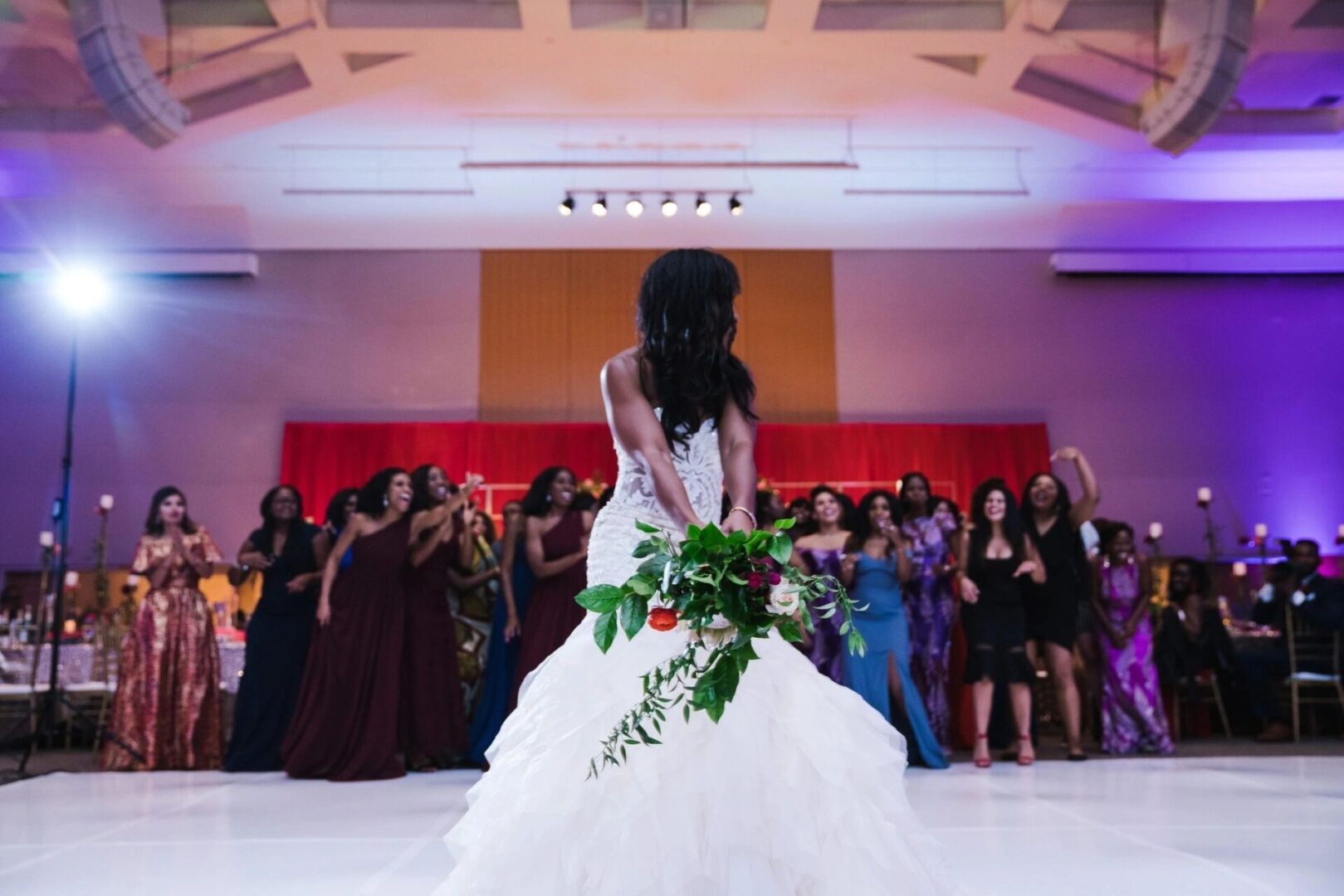 bride throwing a bouquet