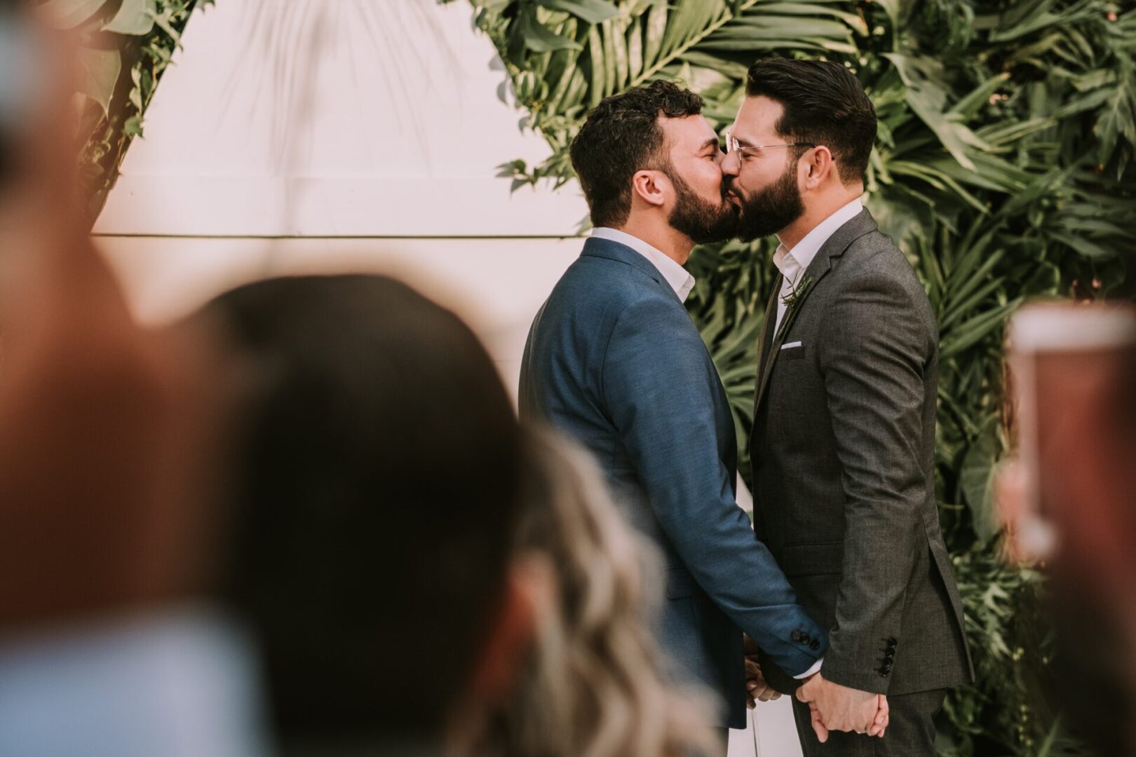 two men kissing each other